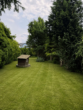 Garten hinter dem Haus - Großzügiges Einfamilienhaus mit 7 Zimmern, großem Garten und zusätzlichem Entwicklungspotenzial